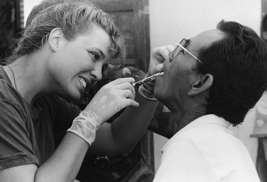 Dentist examining gums and teeth with dental instruments